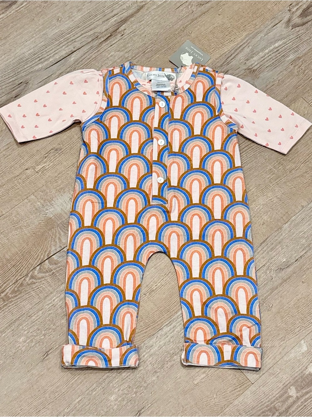 Lucky Jade Rock Your Baby Pink & Multicolor Rainbow One-Piece